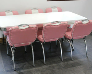 Large Booth Table With Pink Studded Chairs