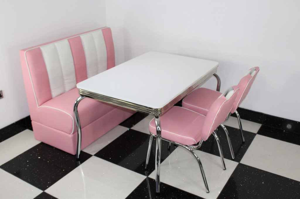 Pink Booth, 2 Chairs and White Four Legged Table